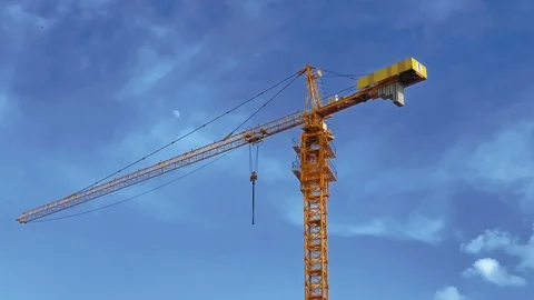 The  powerful beautiful construction crane without logos stands against a calm  Stock Footage 118851733