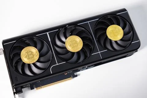 Powerful black GPU with three fans and Bitcoin coins placed on top, symboli.. Stock Photos