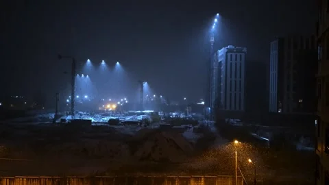 Powerful Blue Spotlights Create Light Beams Above Industrial Construction S.. Video stock 293298396