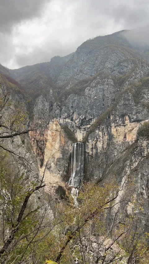Powerful Boka Waterfall Flowing Over Cliff in Slovenia Stock Footage 335226709