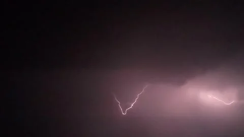 Powerful Branching Thunder Lightning Bolts Striking Across the Dark Purple Night Stock Footage 331057193