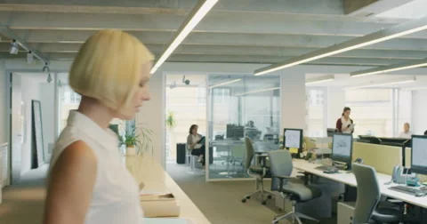 Powerful Businesswoman leader making decisions walking through busy office under Stock Footage 59688500