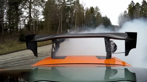 Powerful Car Drifting on a circuit track, Creating Huge Smoke Trails, Rear POV 库存影片 141584199