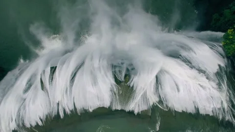 Powerful cascading waterfall flowing down cliff aerial view Stock-Footage 333133820