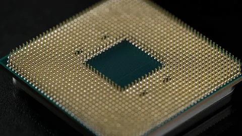 Powerful central processing unit presented in macro. Contact feet are gold Stock-Footage 144546554