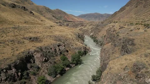 Powerful Chong-Kemin River flowing through Kyrgyzstan canyon Stock Footage 345219529