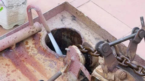 Powerful close-up of a heavily rusty anchor chain being actively pulled up Stock Footage 340513261