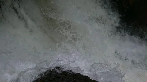 Powerful close-up slow motion shot of a rushing waterfall. Stock Footage 338378686