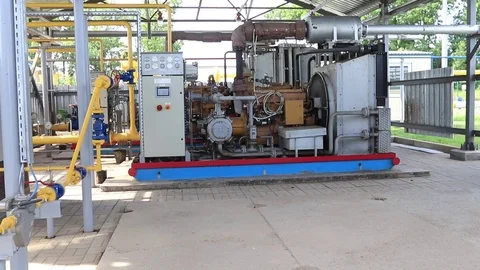 Powerful compressor at a gas plant. Compressing and transporting gas to a Stock Footage 97240495