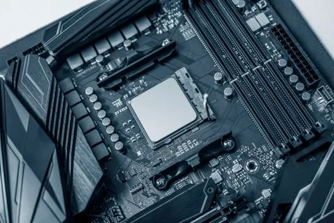 A powerful computer processor and a modern motherboard. Stock Photos