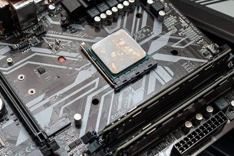 Powerful CPU with applied thermal grease on a personal computer. The process  Stock Photos