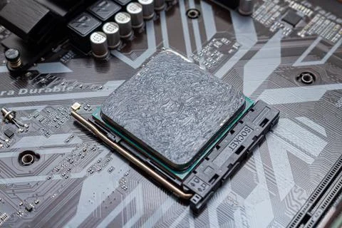 Powerful CPU with applied thermal grease on a personal computer. The process  Stock Photos