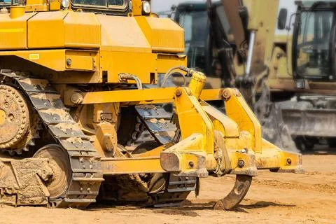 Powerful crawler bulldozer close-up at the construction site. Construction eq Photos
