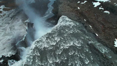 Powerful Dettifoss waterfall cascading through rugged Icelandic landscape Stock Footage 313151117