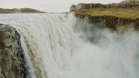 Powerful Dettifoss Waterfall in Iceland with Dramatic Mist and Rocky Landscape Stock Footage 320511001