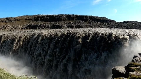 Powerful Dettifoss waterfall with a vibrant rainbow in Iceland Stock Footage 333513437