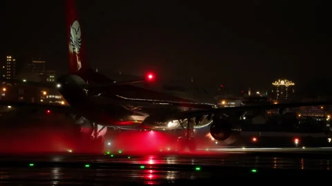 Powerful Engine Water Spray - Airbus A321 Passenger Airplane Takeoff, Rain Night Video stock 257783382