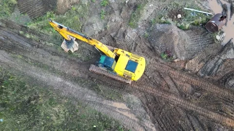 A powerful excavator digs the ground at a construction site. Stock Footage 218732143