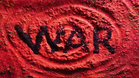 Powerful exploding of colorful powder symbol word war. Slow motion video 4k Stock Footage 248659821