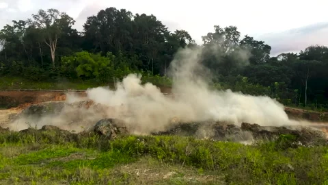 Powerful explosion. Hard rock is crushed in a powerful explosion to make a road. Stock Footage 245273936