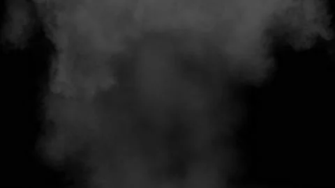 A powerful explosion with a mushroom-shaped cloud of grey smoke against a black Stock Footage 239702416