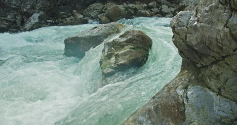 Powerful fast raging whitewater mountain river flow over rocks. Crystal clear Stock Footage 255212299