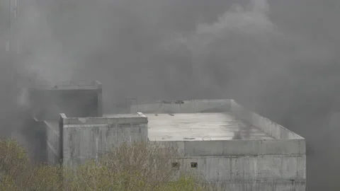 Powerful fire at construction site in building of school under construction Stock Footage 155367720