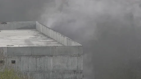 Powerful fire at construction site in building of school under construction Stock Footage 155367815