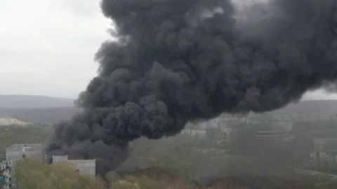 Powerful fire during construction of new school building. Strong smoke billows Stock Footage 155374363