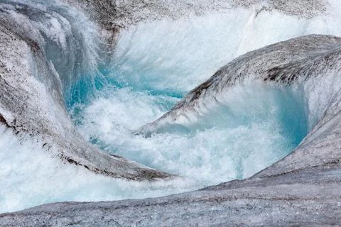 Powerful flow of the river from the melted ice on the Aktru glacier in the Altai Stock Photos