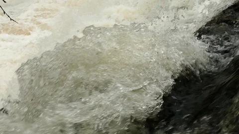The powerful fountain of the rapid flow of the spring mountain river. Stock Footage 102748201