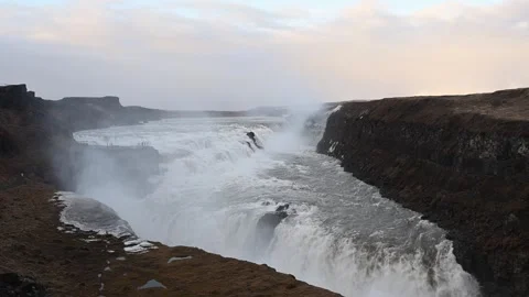 Powerful gullfoss waterfall flowing in iceland's golden circle at sunset Stock Footage 334779454