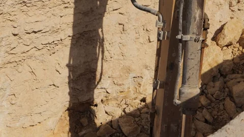 Powerful Hydraulic Hammer Crushing Rocks in Construction Site Stock Footage 263717853