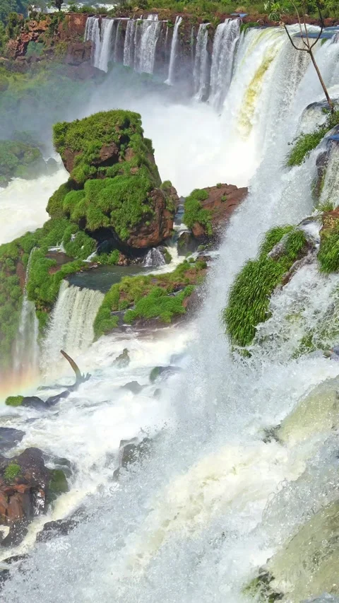 Powerful iguazu falls creating mist and rainbow Stock Footage 338132102