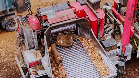 Powerful Industrial Wood Chipper Processing Logs Into Sawdust at a Lumberyard Stock Footage 304572617