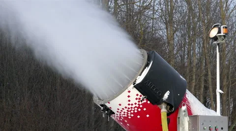 The powerful jet of artificial snow flies under pressure from the nozzles Stock Footage 66432431