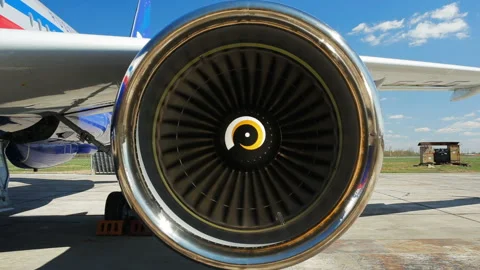Powerful jet engine starts turning against sky Stock Footage 90603417