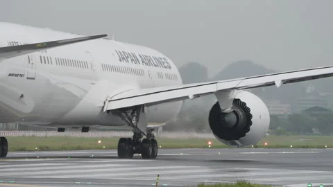 Powerful Jet Engine Water Spray, Boeing 787 Passenger Airplane Takeoff Taipei Video stock 258229286