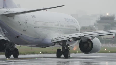 Powerful Jet Engine Water Spray, Boeing 737 Passenger Airplane Takeoff in Rain Video stock 258426918