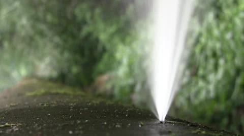 Powerful jet of water flowing from a broken metal duct Stock Footage 57940482