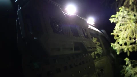 Powerful led lights illuminate rear of off road vehicle at night Video stock 313258486