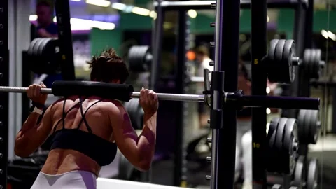 Powerful legs and elastic buttocks are the result of discipline and the right ap Stock Footage 296333411