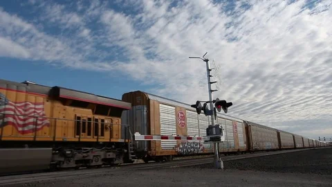 Powerful locomotive transporting a freight train Stock Footage 77171837