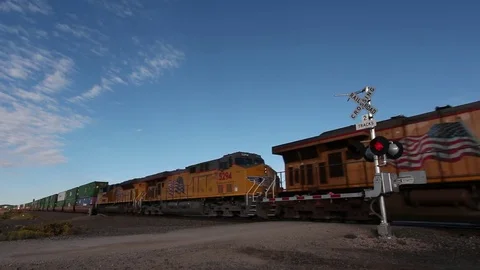 Powerful locomotive transporting a freight train 動画素材 77171879