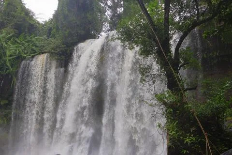 Powerful Main Waterfall Cascading into Misty Pool at Phnom Kulen, Cambodia Stock Photos