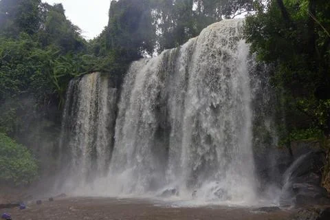 Powerful Main Waterfall Cascading into Misty Pool at Phnom Kulen, Cambodia Stock Photos