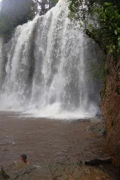 Powerful Main Waterfall Cascading into Misty Pool at Phnom Kulen, Cambodia Stock Photos