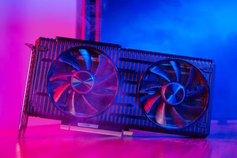 Powerful modern GPU Video Card with two fans with PC case on background in neon Stock Photos