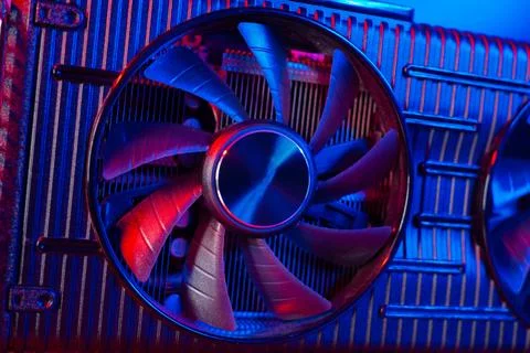 Powerful modern GPU Video Card with two fans with PC case on background in neon Stock Photos