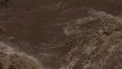 Powerful monsoon floodwaters overflowing the Beas river in the Himalayas Stock Footage 322509713